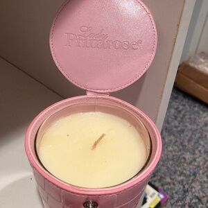 Beautiful candle that smells delicious. Brand new in its own container.